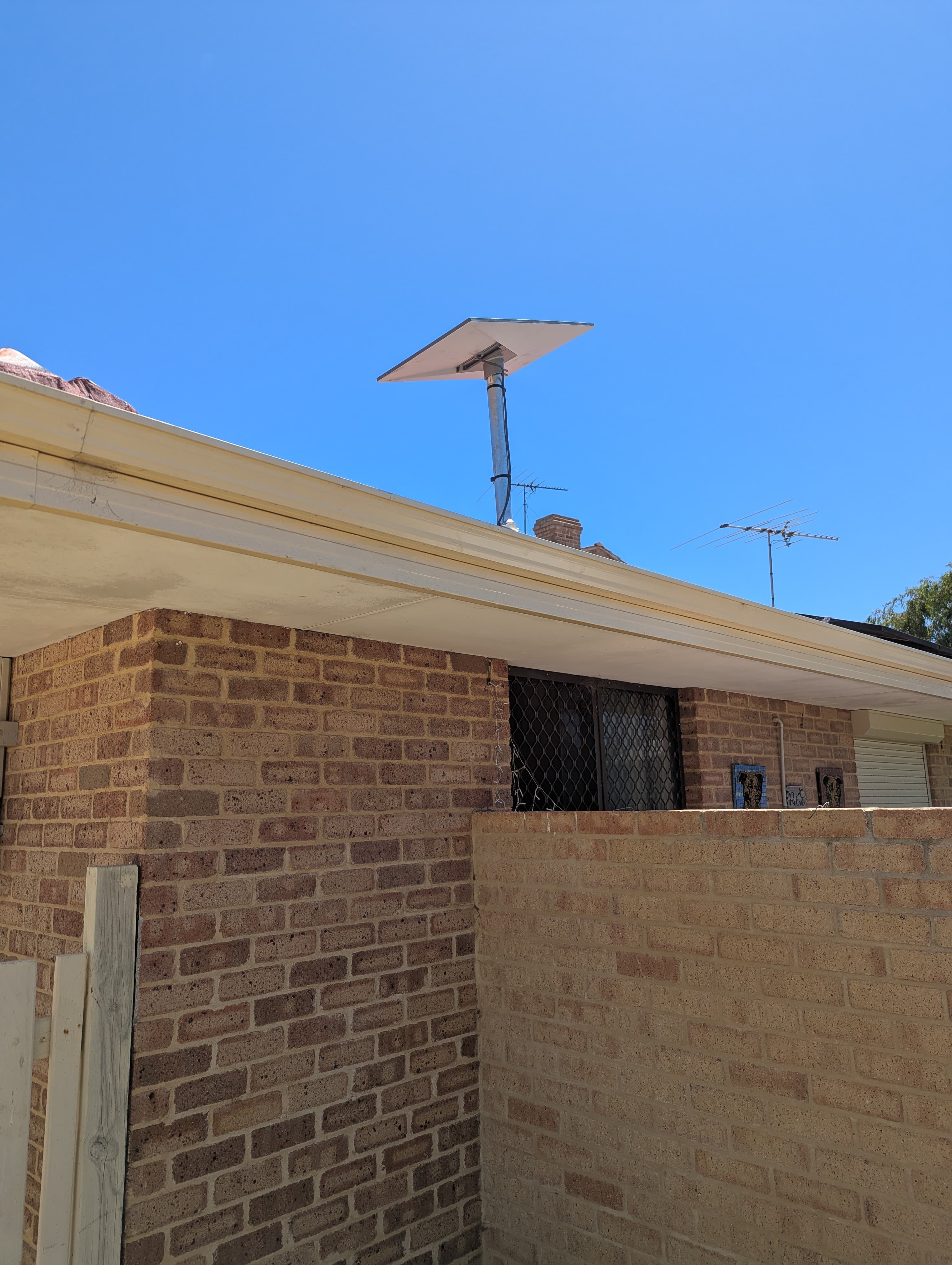 Starlink dish installed on a roof with clear sky view in a Perth home