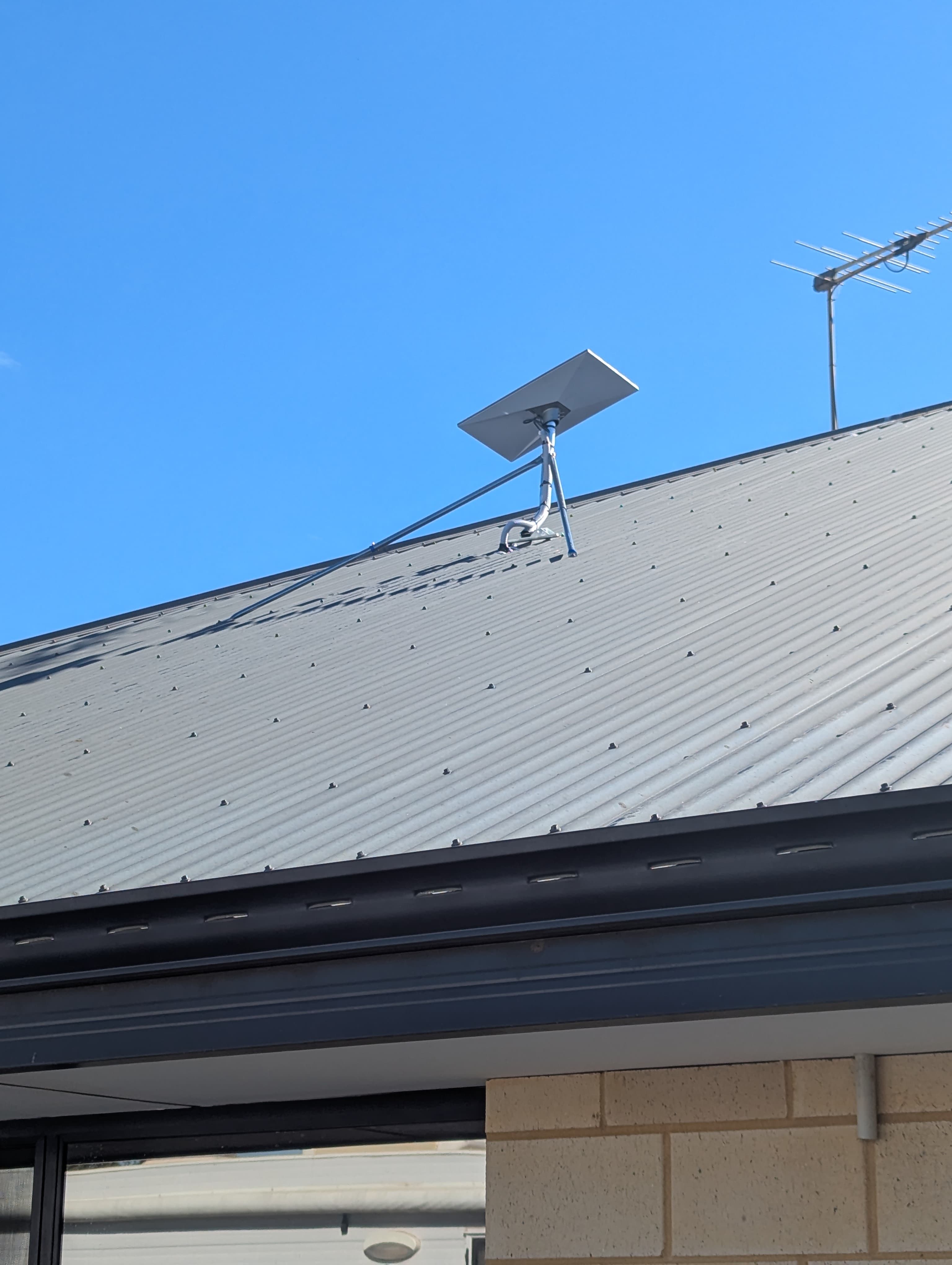 Starlink dish mounted securely on a roof