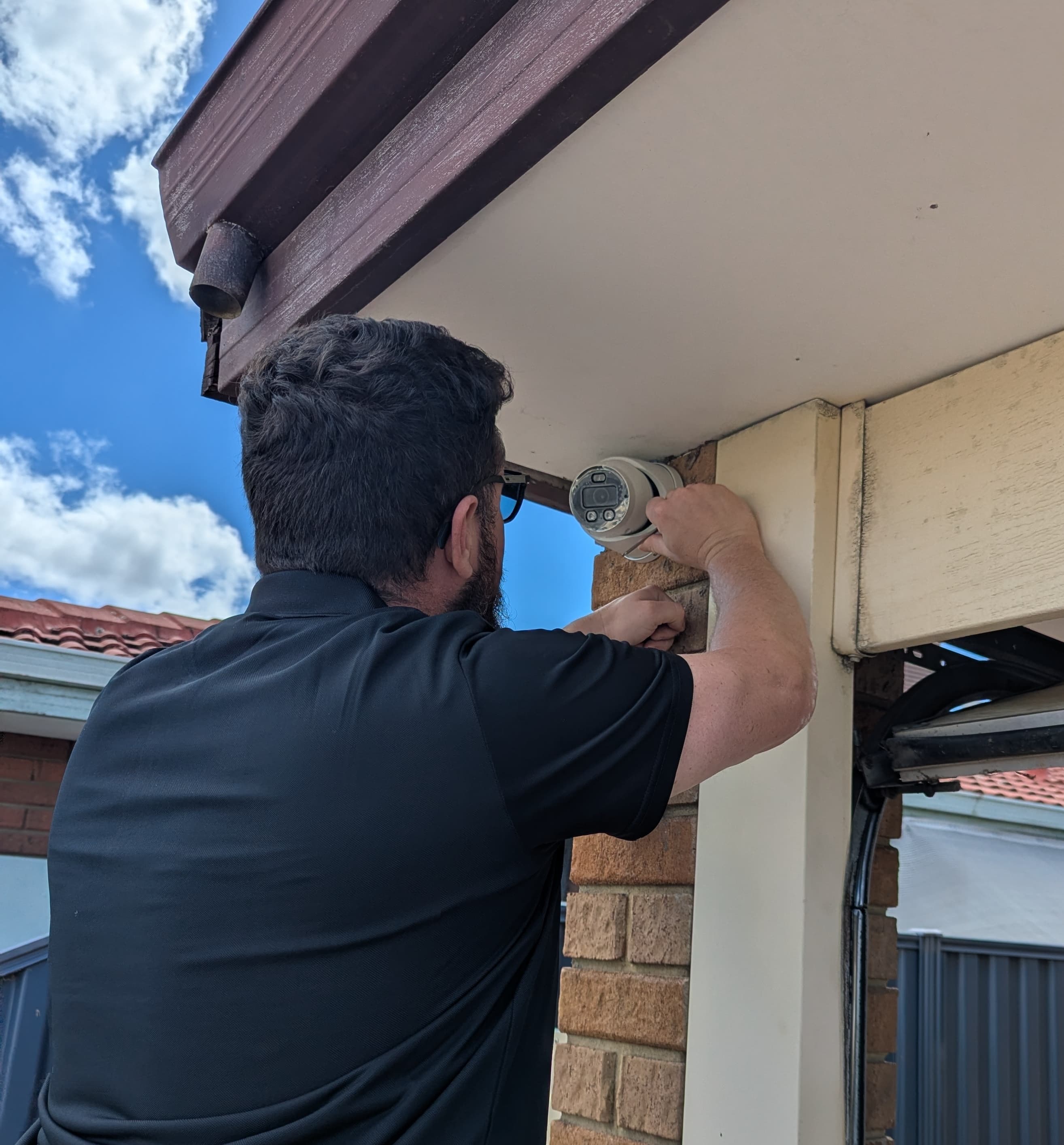 Technician repairing CCTV system