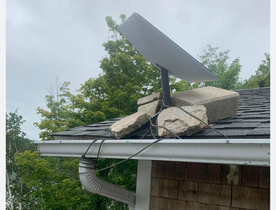 Starlink dish mounted on a roof