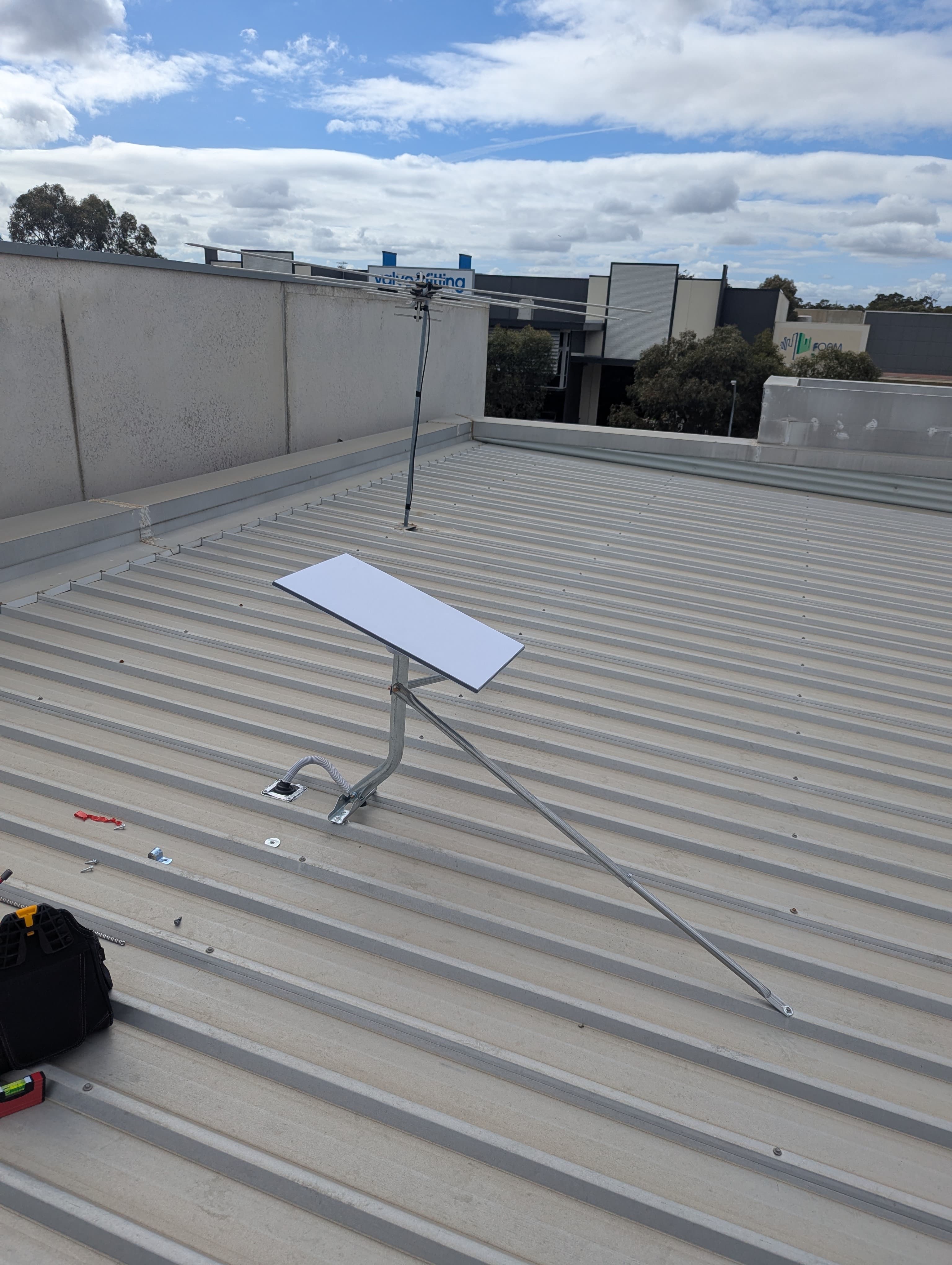 Starlink dish and braced roof mount at a Henderson premises