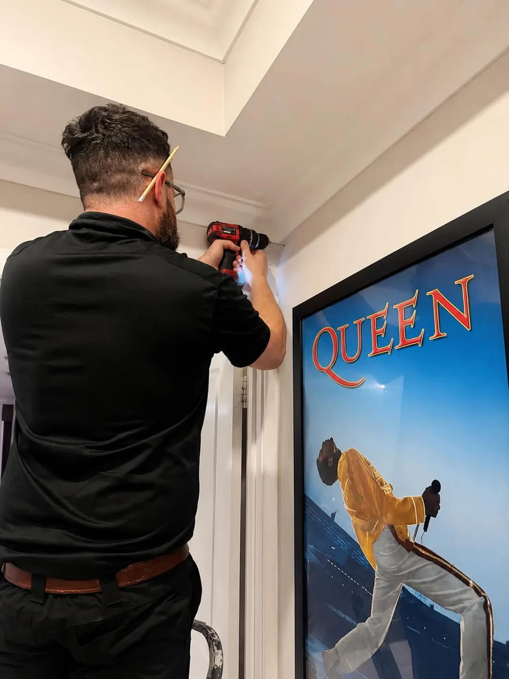 Daniel from Blake Smart Solutions drilling for a neat Wi-Fi access point installation