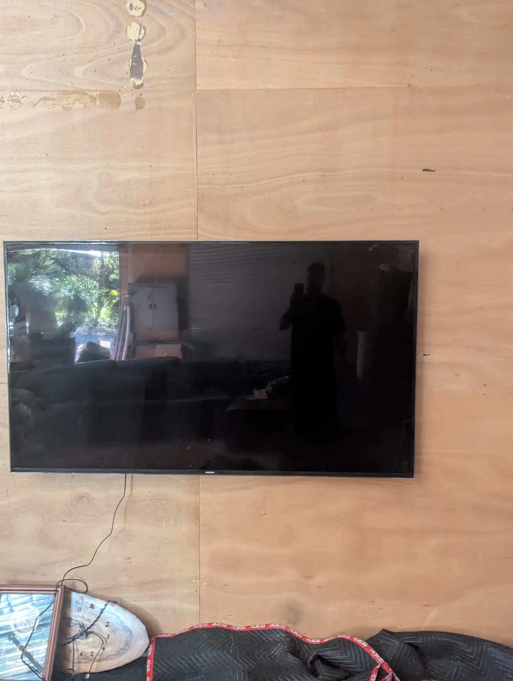 Wall-mounted television installed inside the connected Darlington shed