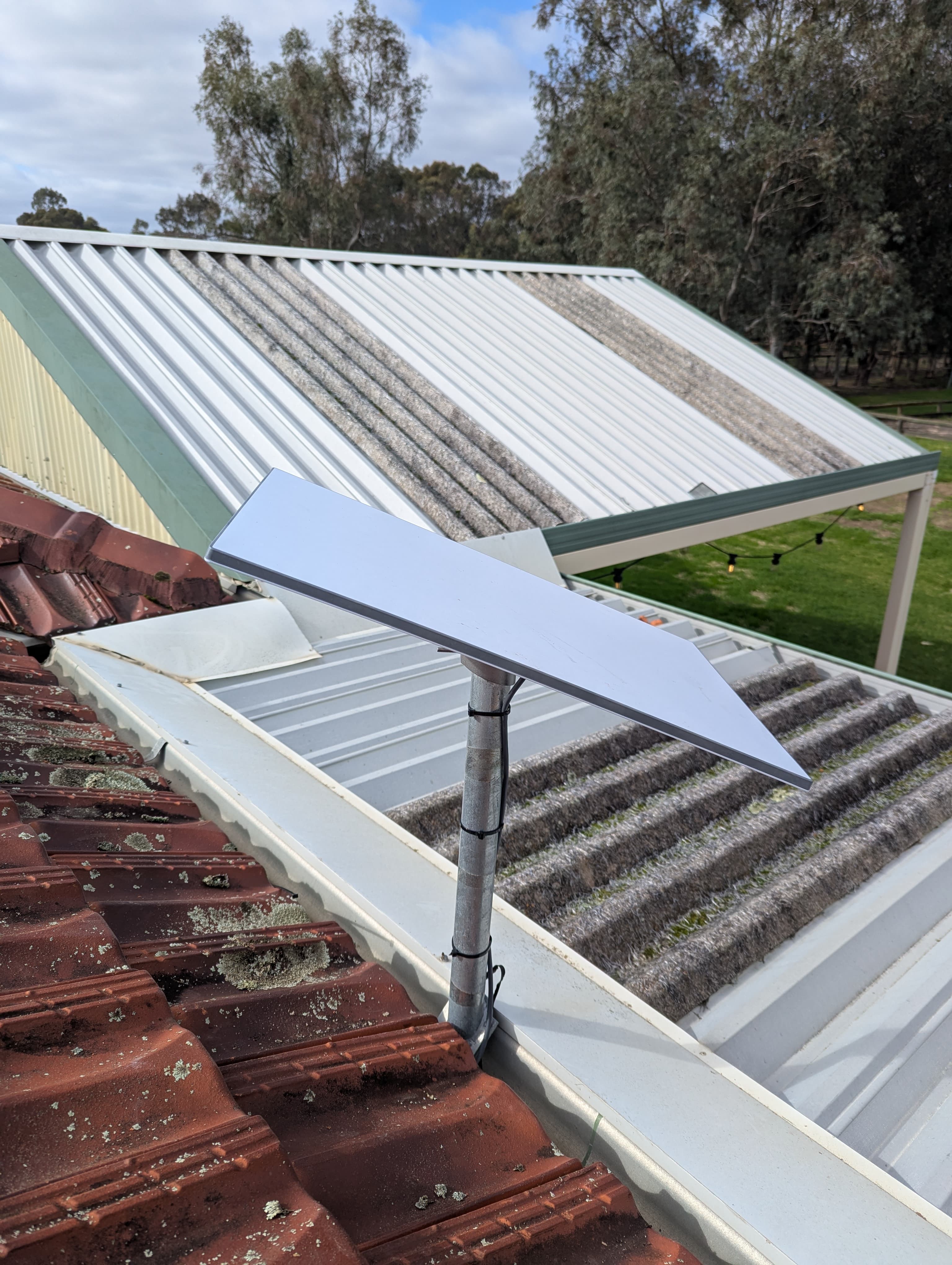 Starlink dish mounted on a roof at a rural Oakford property