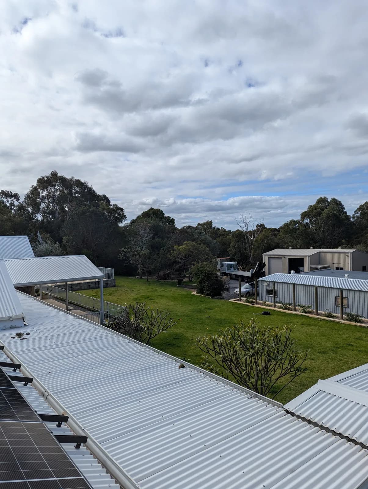 View across a Wanneroo property to a detached shed connected by a wireless bridge